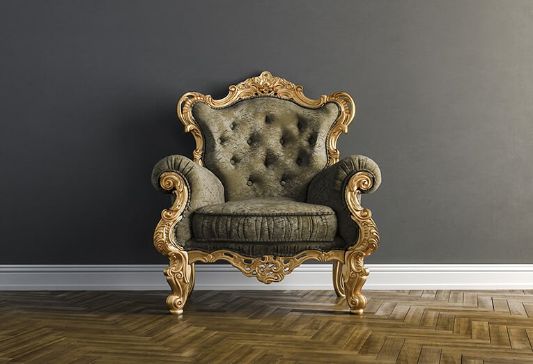 Luxury comfortable armchair with gold details